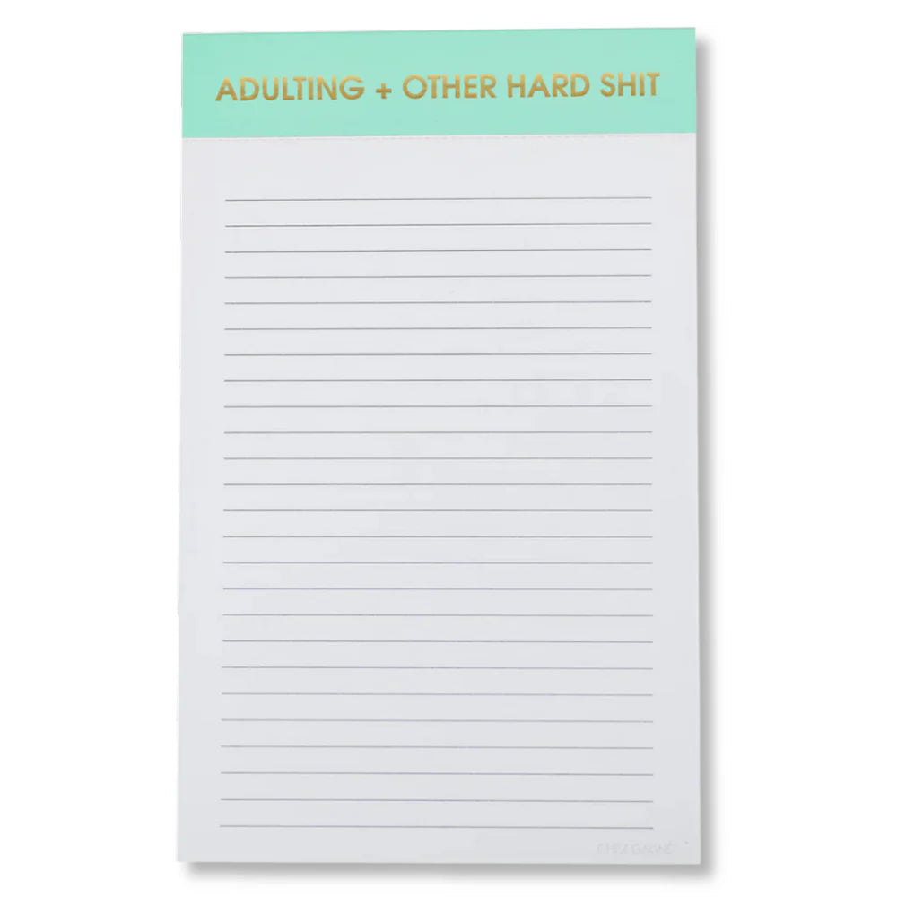 notepad with mint top on white background