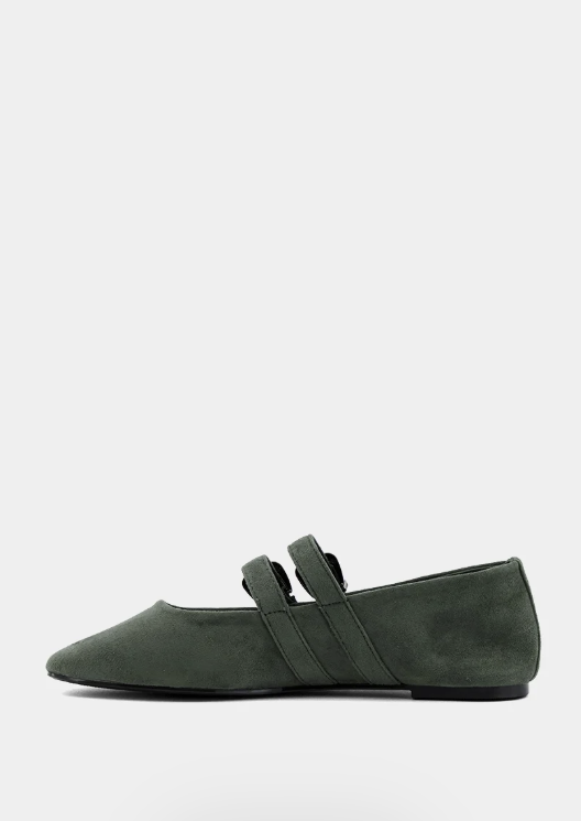 Black suede loafer on a white background