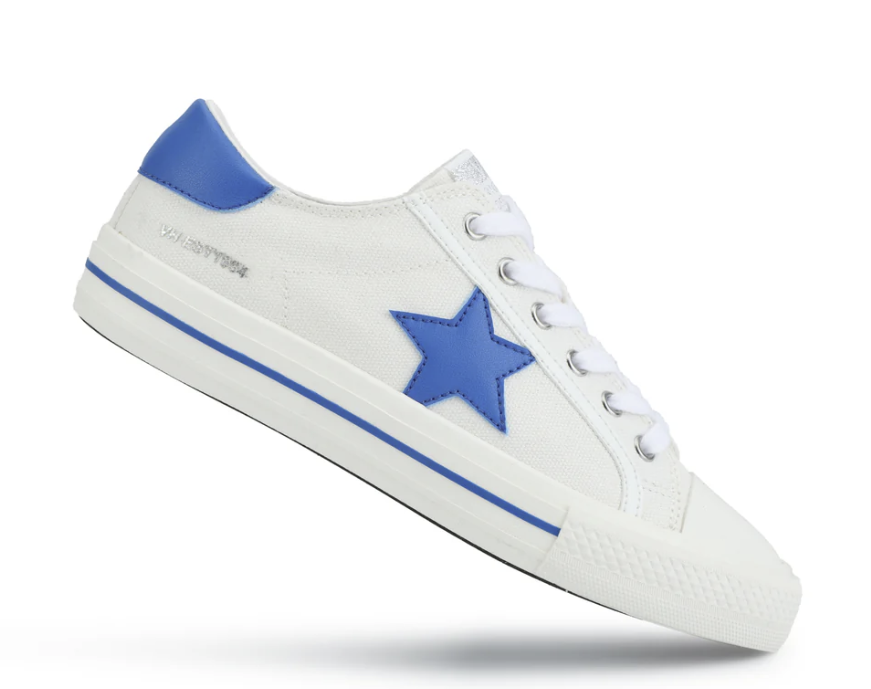 White sneaker with a blue star and sole on a white background