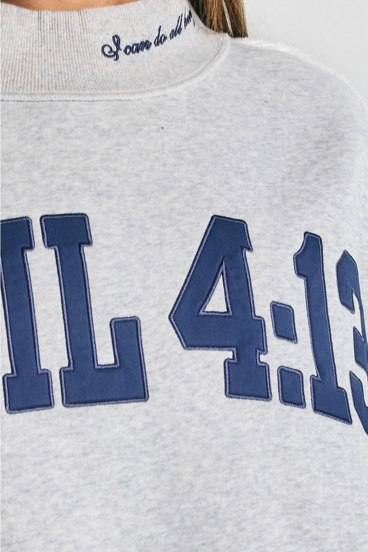 Gray sweatshirt with blue text &