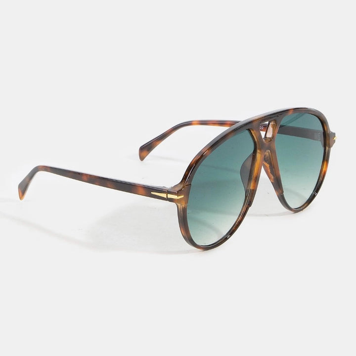 Sunglasses with tortoiseshell frame and green gradient lenses on a white background