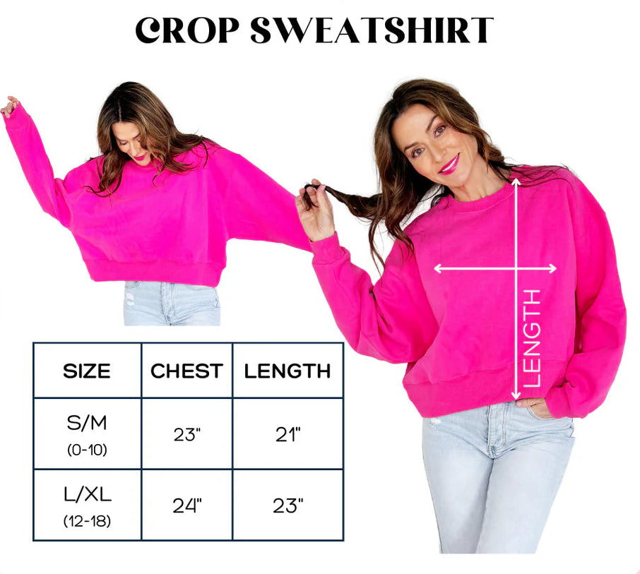 Pink crop sweatshirt with size chart and measurements on a white background