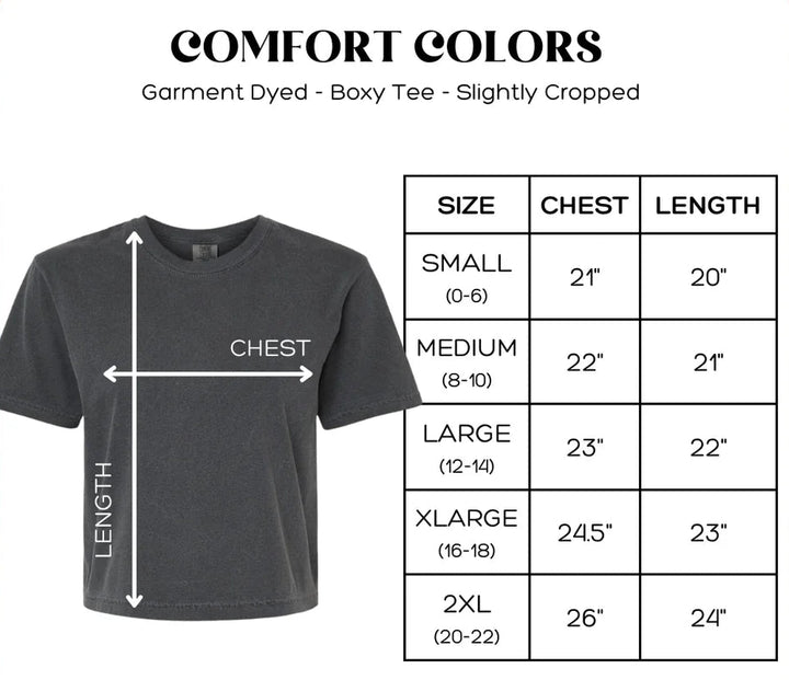 Gray t-shirt with size chart on a pink background