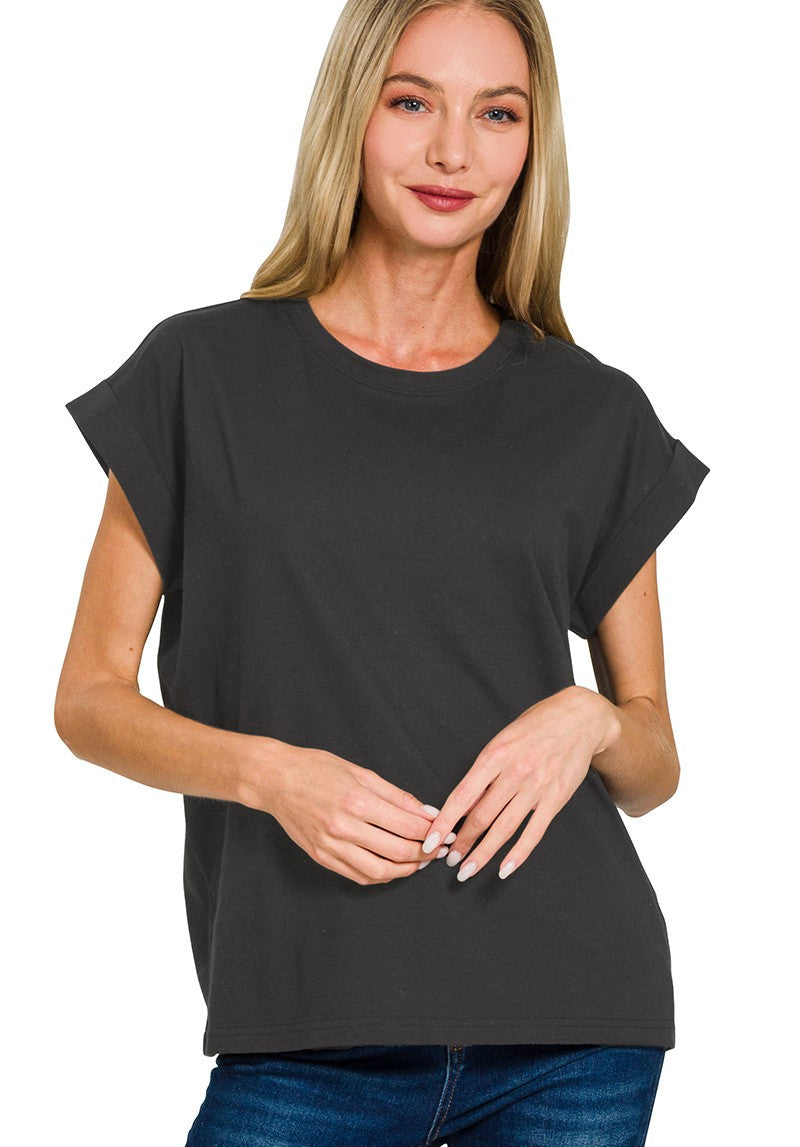 Woman wearing a black t-shirt with a plain background