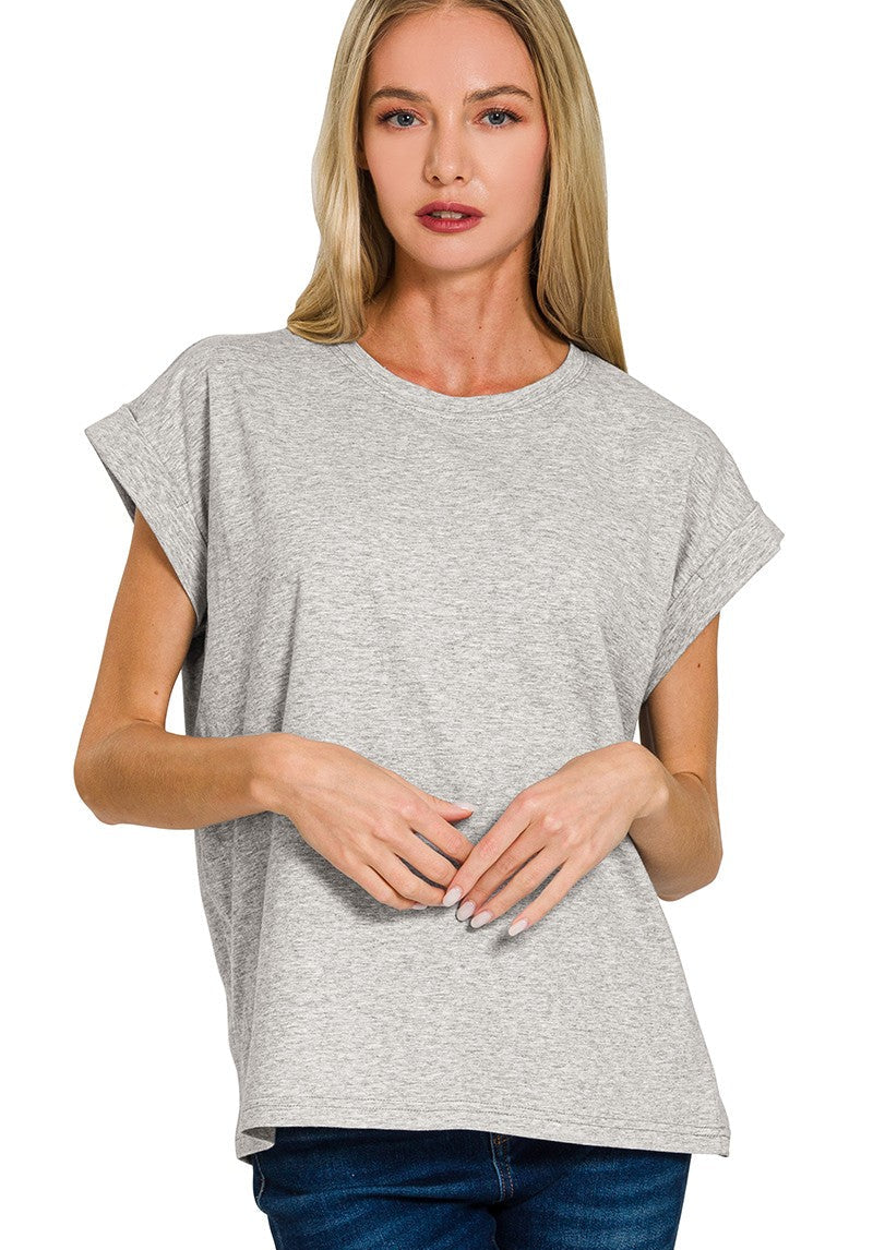 Woman wearing a gray t-shirt and blue jeans on a white background