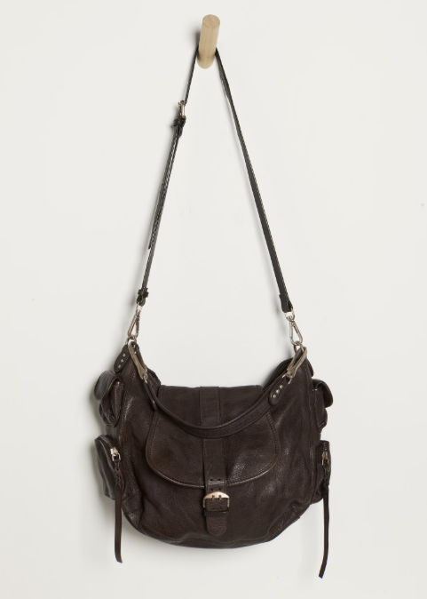 Large espresso brown purse hanging on hook on white background