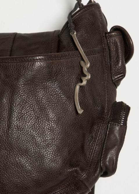 Close up of espresso brown purse on white background