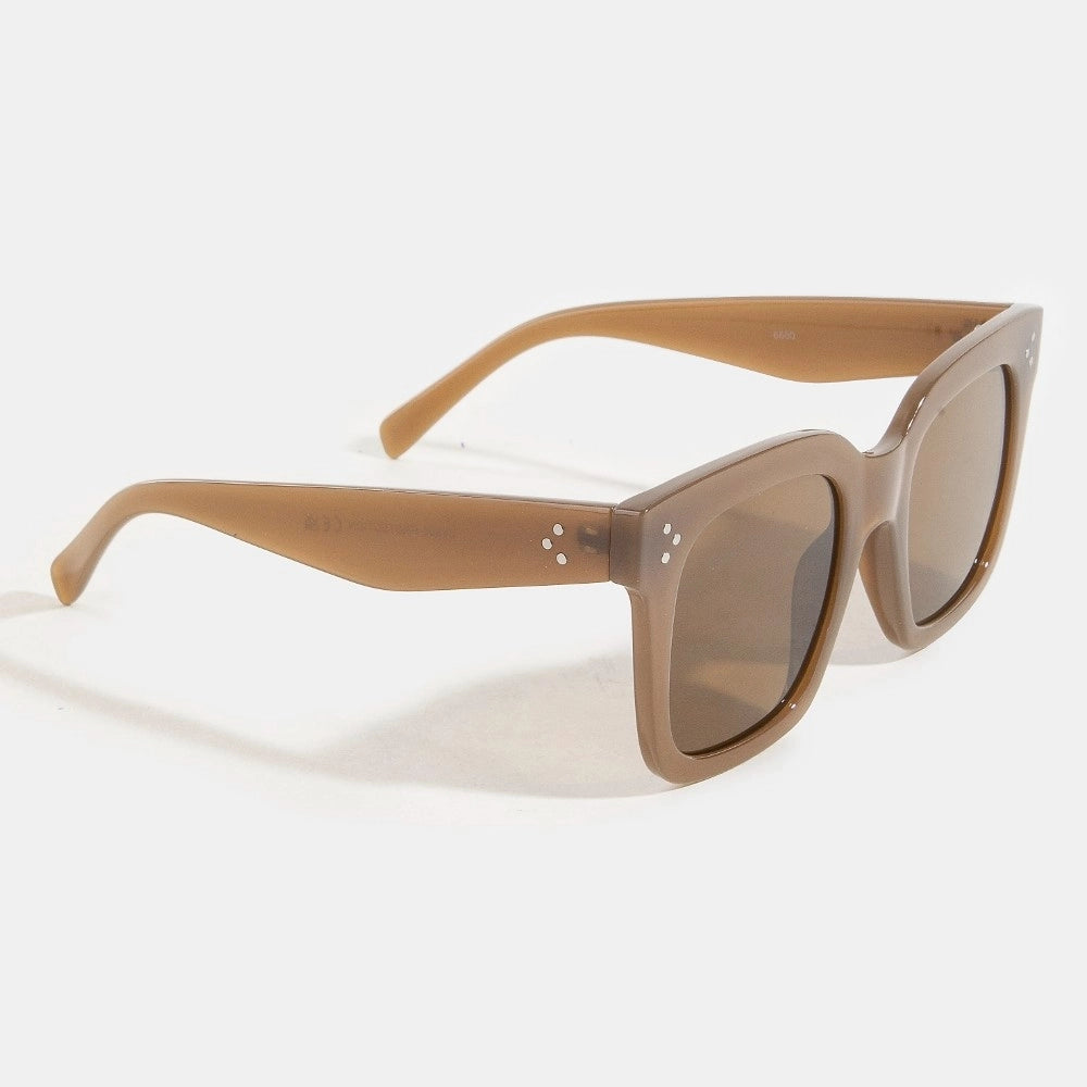 Sunglasses with brown frame and dark lenses on a white background