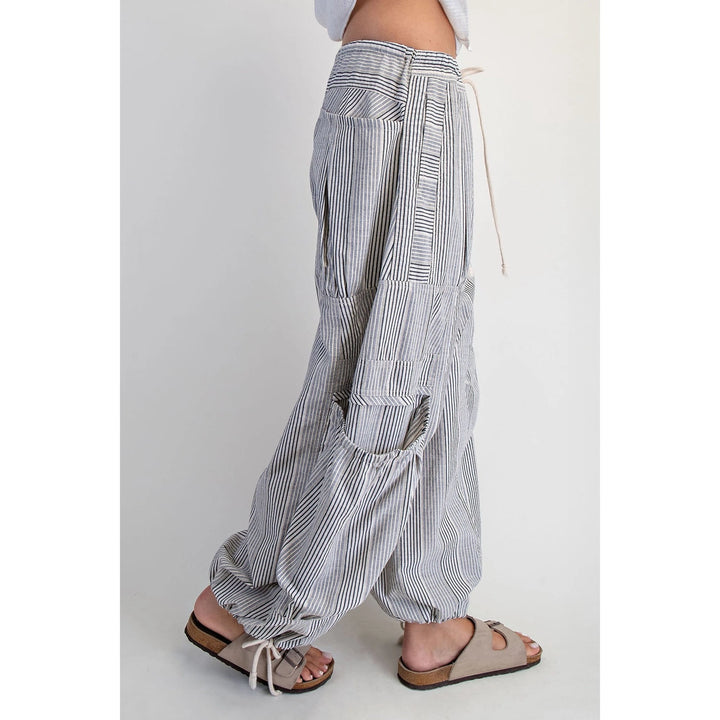 Striped wide-leg pants worn by a person on a white background