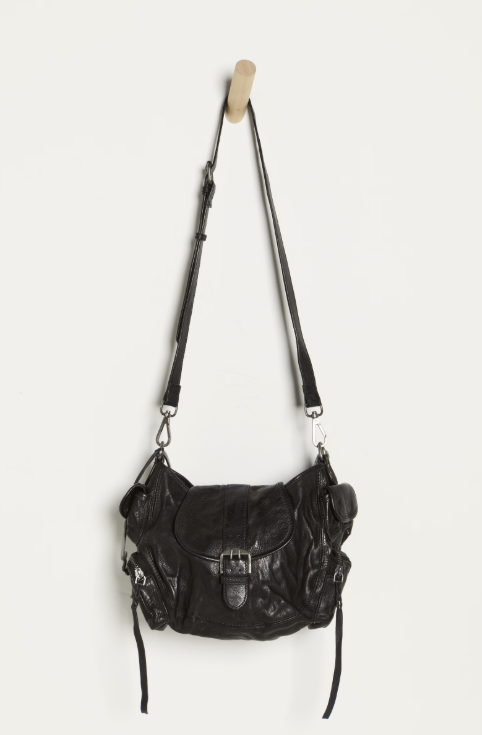 Black leather handbag with a strap on a white background