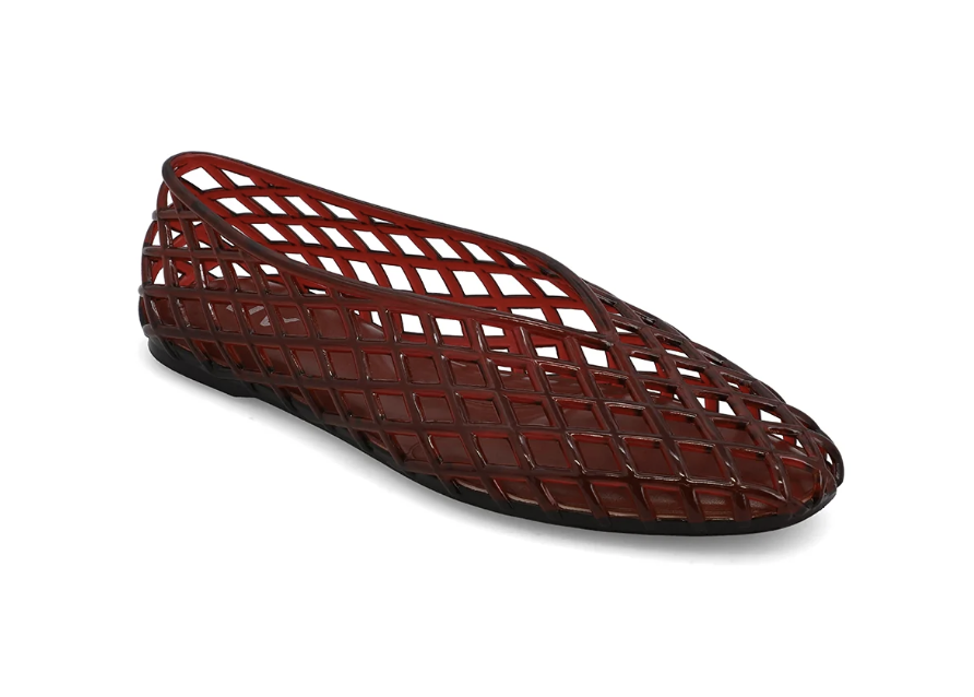 Single jelly flat with criss cross pattern in burgundy color on plain background