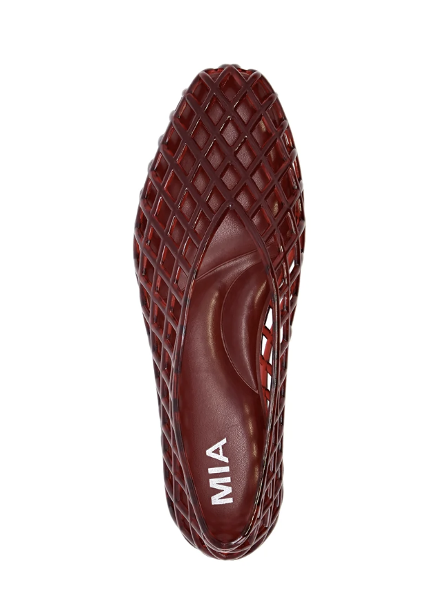 A single dark red mesh slip-on shoe shown from a top-down view on a plain white background. The brand name &