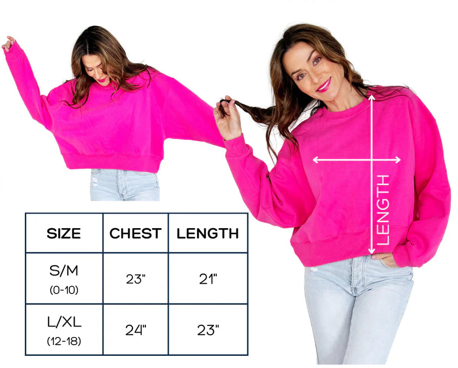 Pink crop sweatshirt with size chart and measurements on a white background