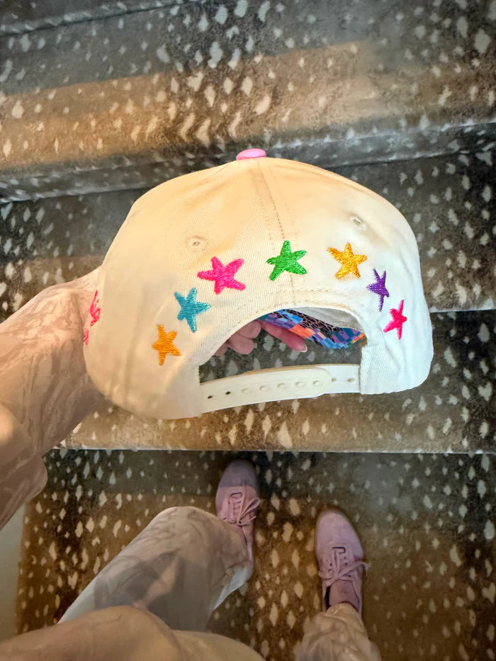 Colorful star-patterned cap on a reflective surface