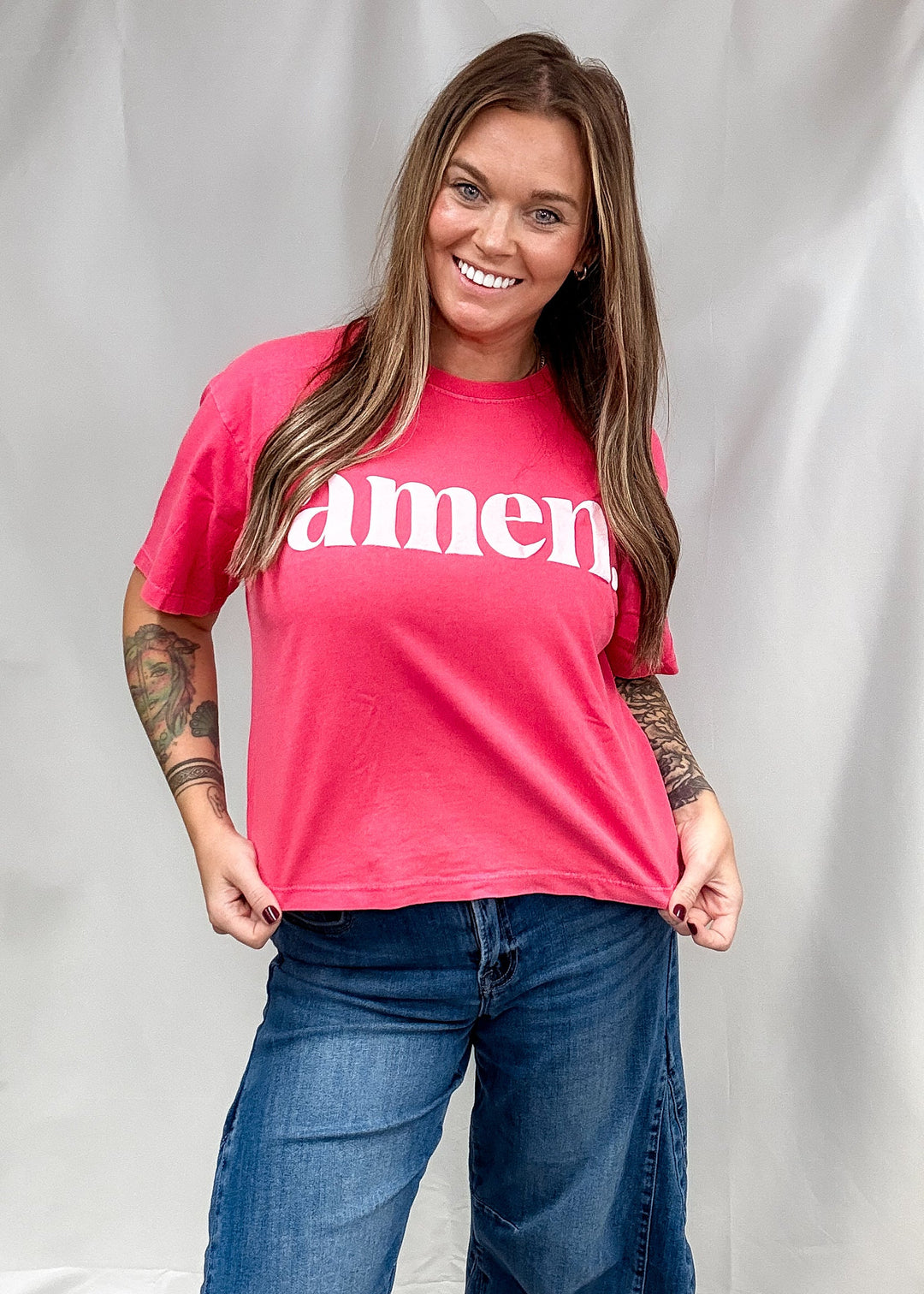 Woman wearing red shirt saying &