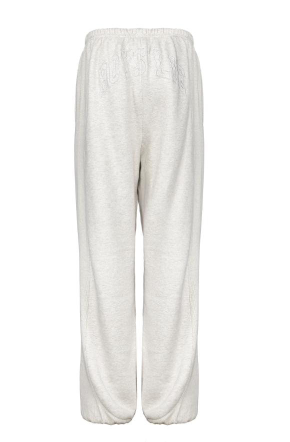 A pair of light heather gray sweatpants with a subtle tonal embroidered logo on the upper left leg, shown against a plain white background.