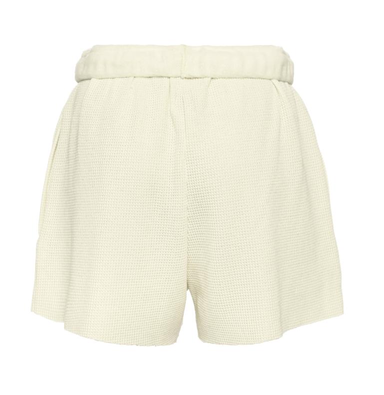 White textured shorts on a white background