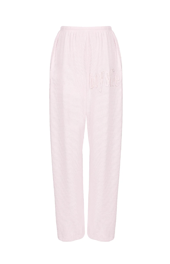 Pink sweatpants on white background