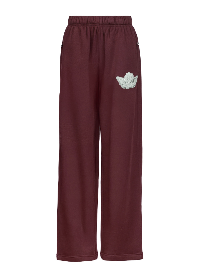 Burgundy sweatpants with light green cherub decal on white background