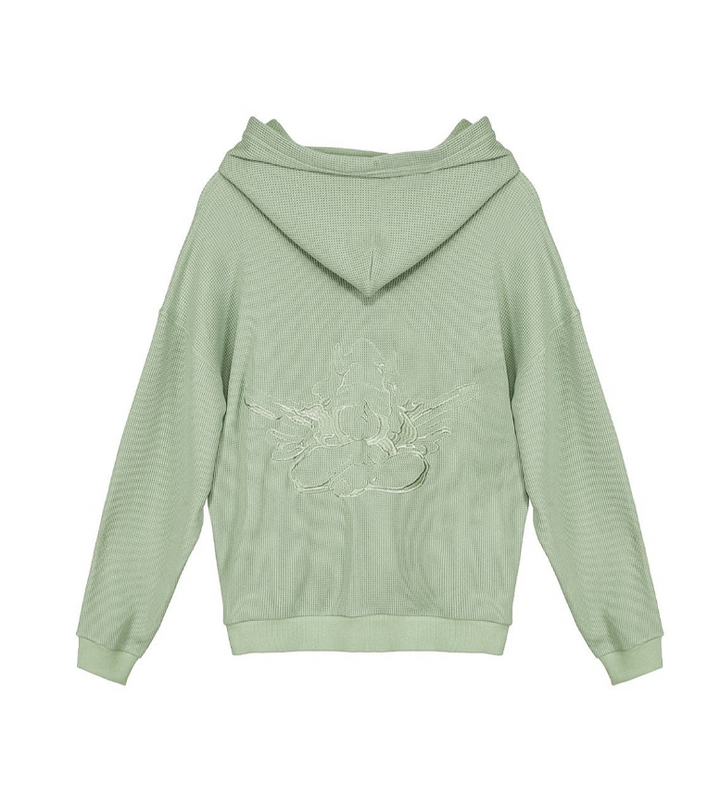 A sage green hooded sweatshirt with a textured, ribbed knit pattern and a white line-art graphic of a seated figure on the back, shown against a plain white background.