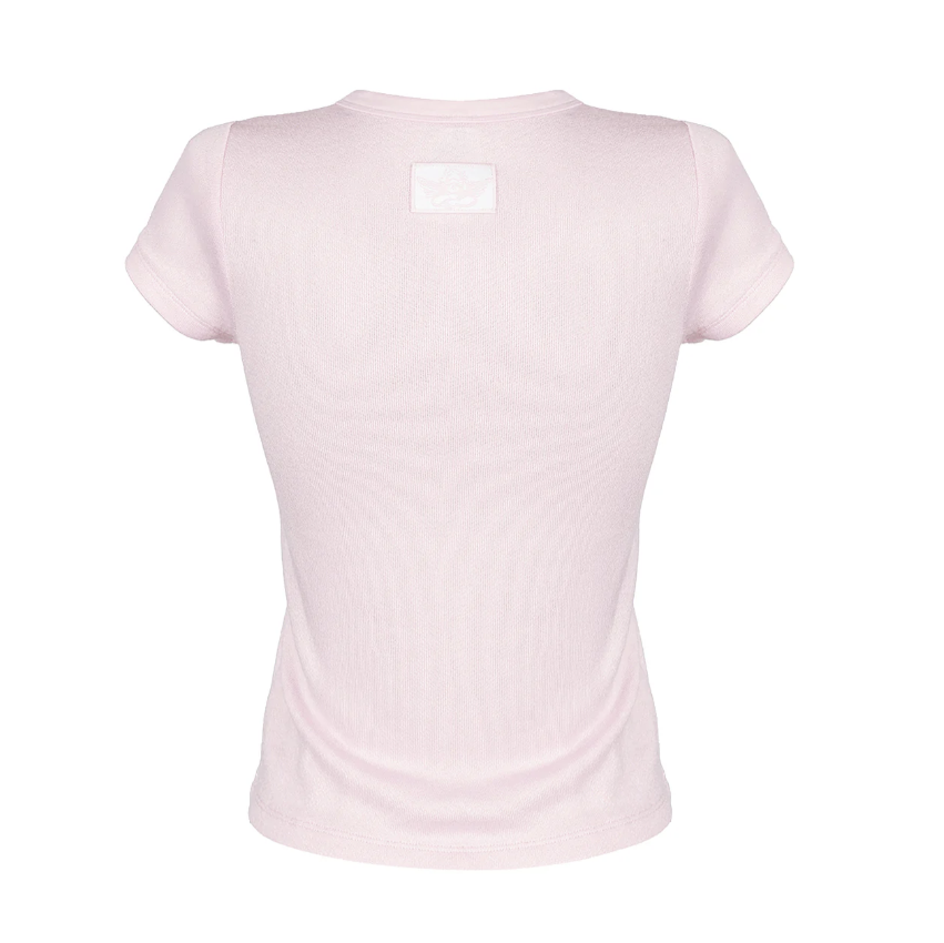 A light pink short-sleeve ribbed t-shirt shown from the back, featuring a small blank white rectangular patch on the upper back, set against a plain white background.