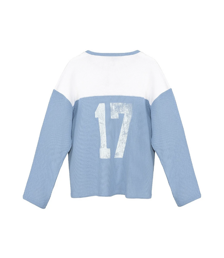 Blue and white thermal long sleeve with number 17 on the back on white background
