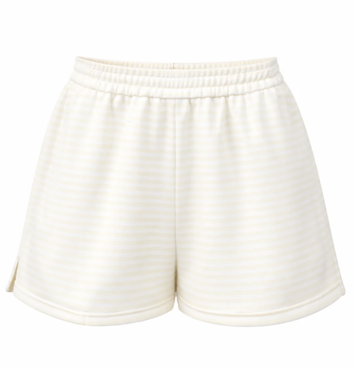 Yellow and white striped shorts on white background
