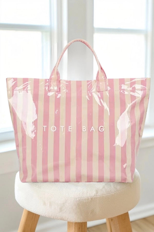 Pink and Tan stripe tote bag sitting on stool
