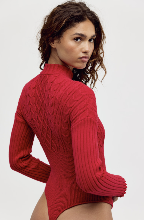 Woman shown from back wearing red mock neck bodysuit on white background