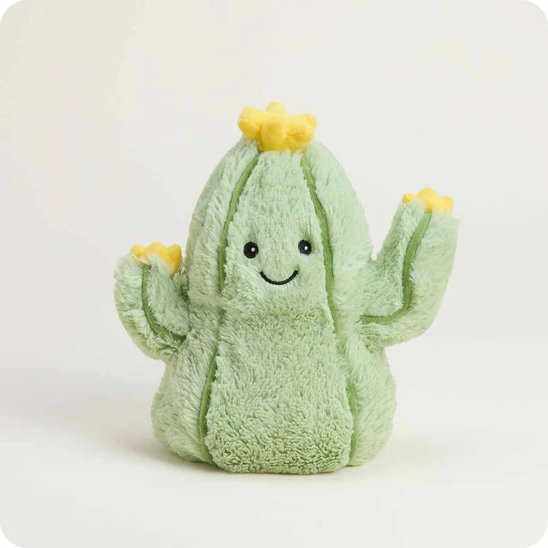 Plush cactus toy with a smiling face and yellow accents on a white background