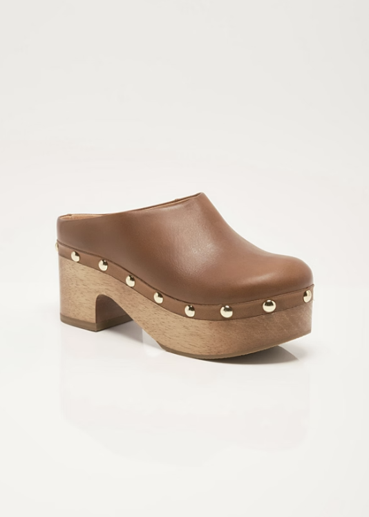 Single leather clog with stud details and wooden bottom on plain background