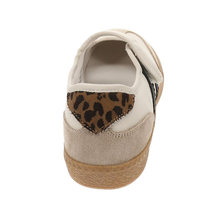 Back of single sneaker shown with leopard print on white background