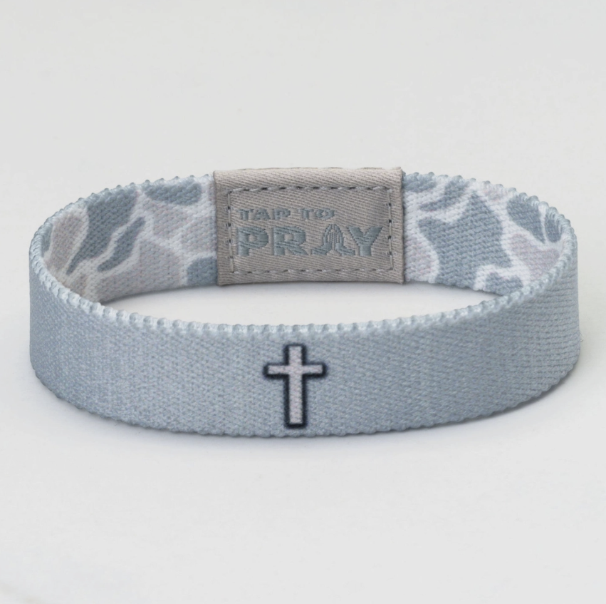 Gray wristband with star pattern and cross design on a white background