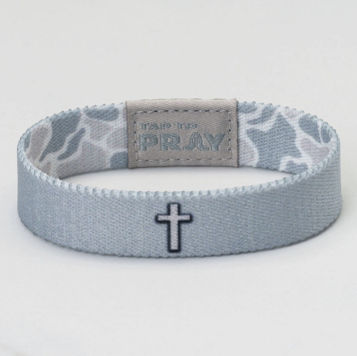 Gray wristband with star pattern and cross design on a white background