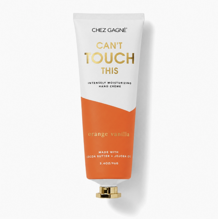 A tube of Chez Gagnée hand cream in the Orange Vanilla scent, featuring a white and orange design with gold lettering, set against a clean white background with a soft shadow.