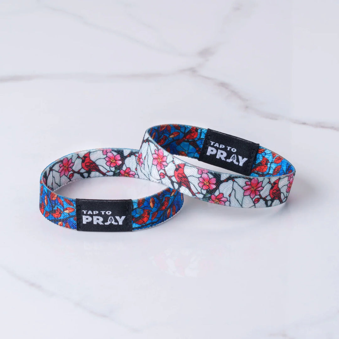 Two floral-patterned wristbands with &