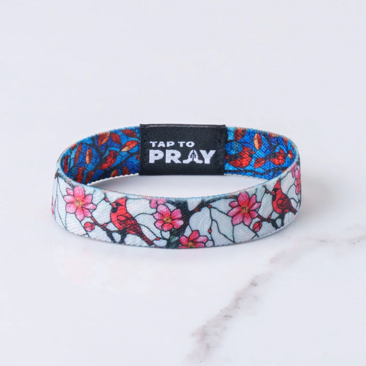 Wristband with floral and bird design and &