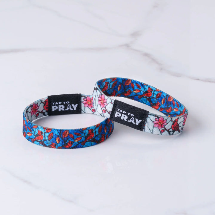 Two floral-patterned wristbands with &