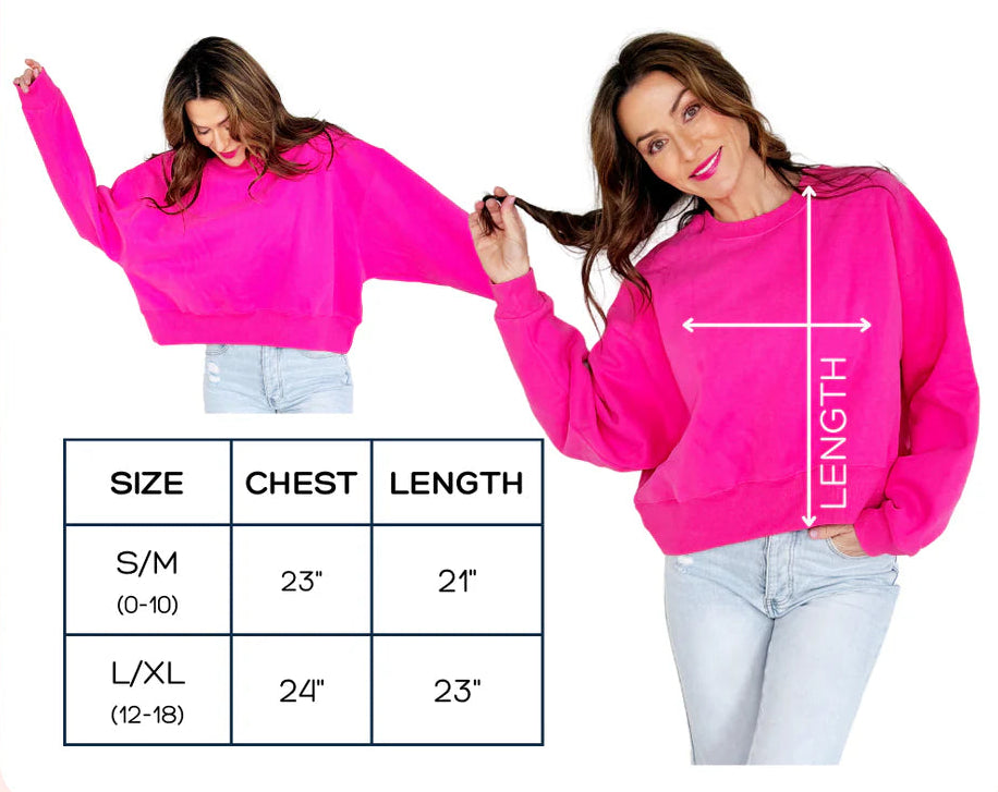 Pink crop sweatshirt with size chart and measurements on a white background