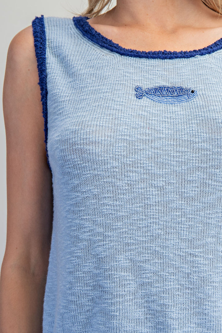 Close up of blue knit tank with beaded fish detail 