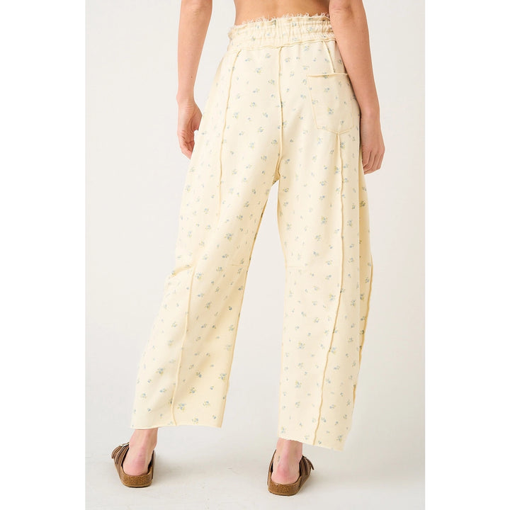Person wearing light-colored pants with a subtle pattern on a white background