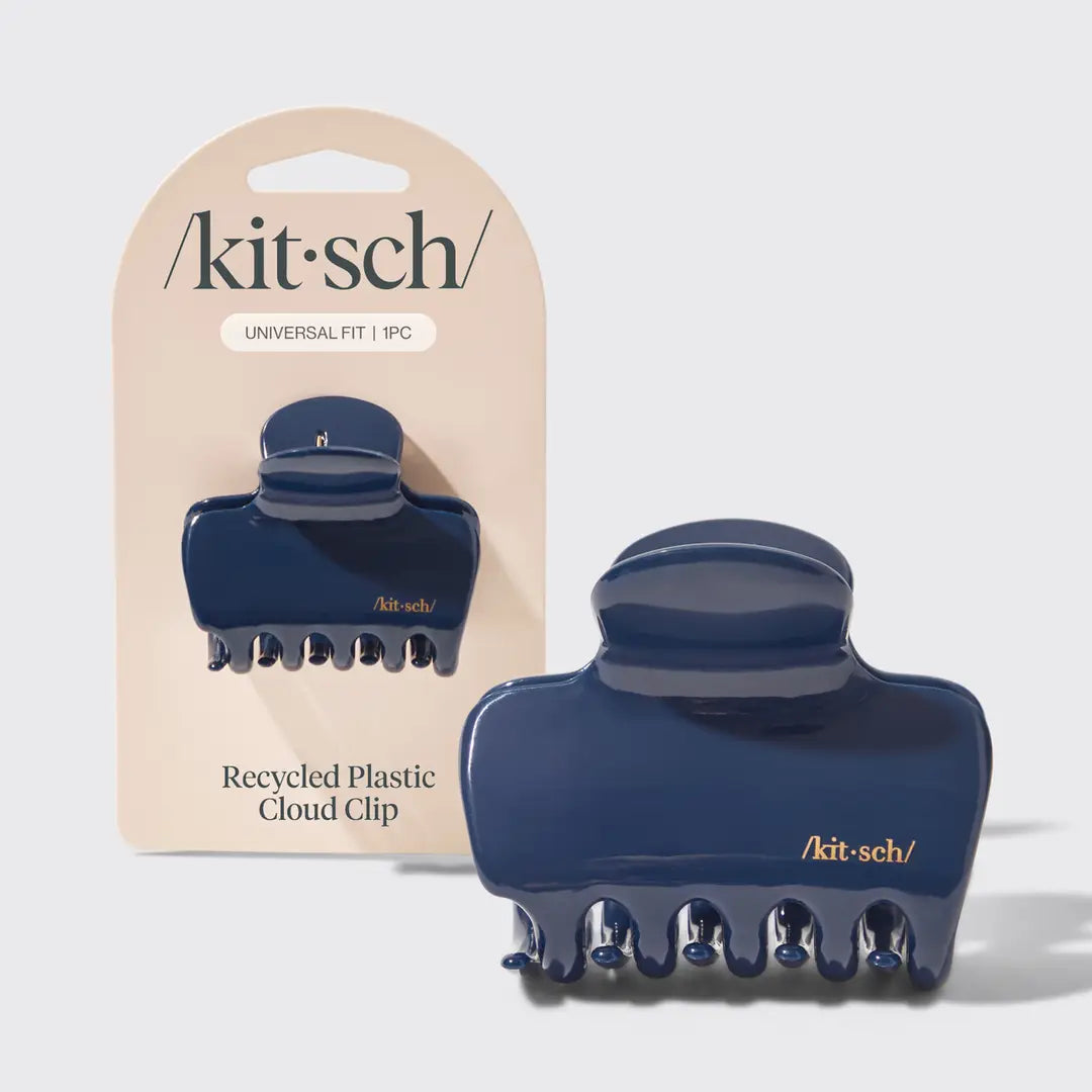 Blue claw clip in packaging on plain background