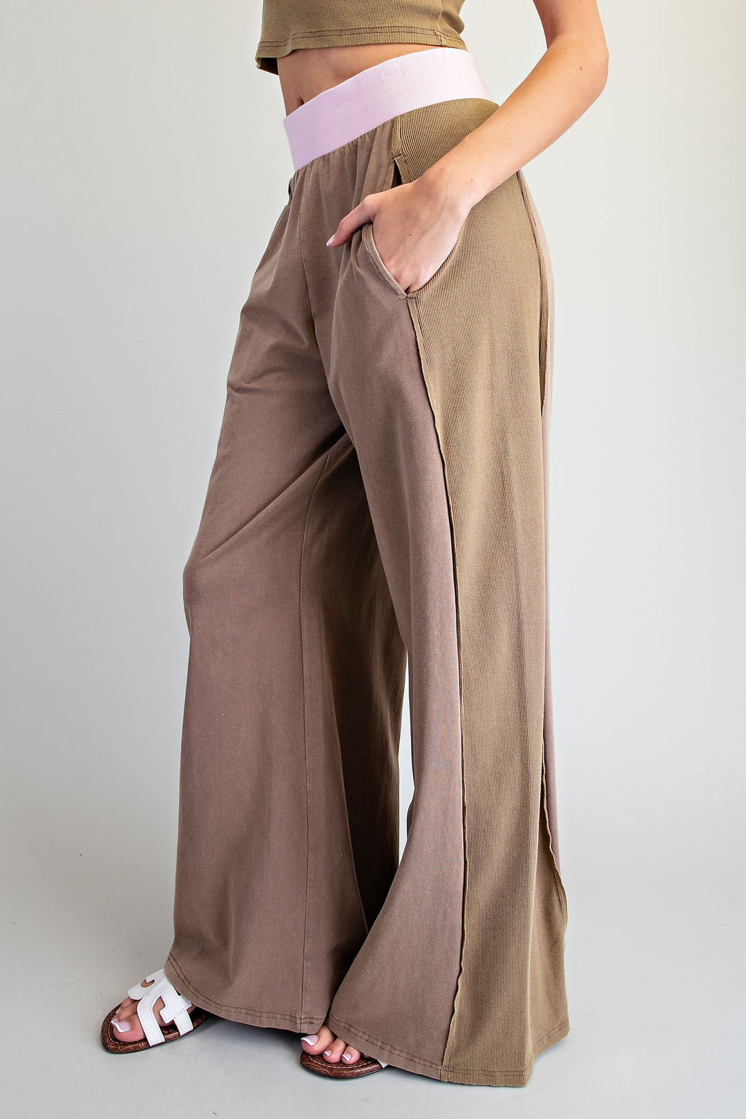 Brown wide-leg pants worn by a person on a plain background
