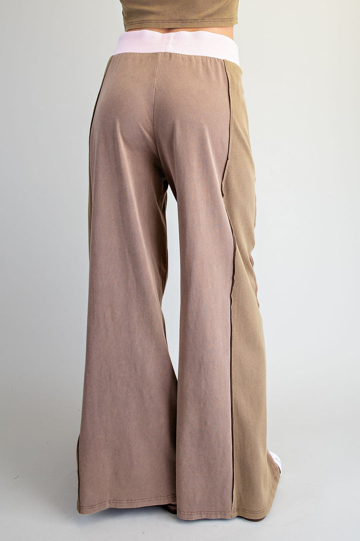 Brown wide-leg pants on a plain background
