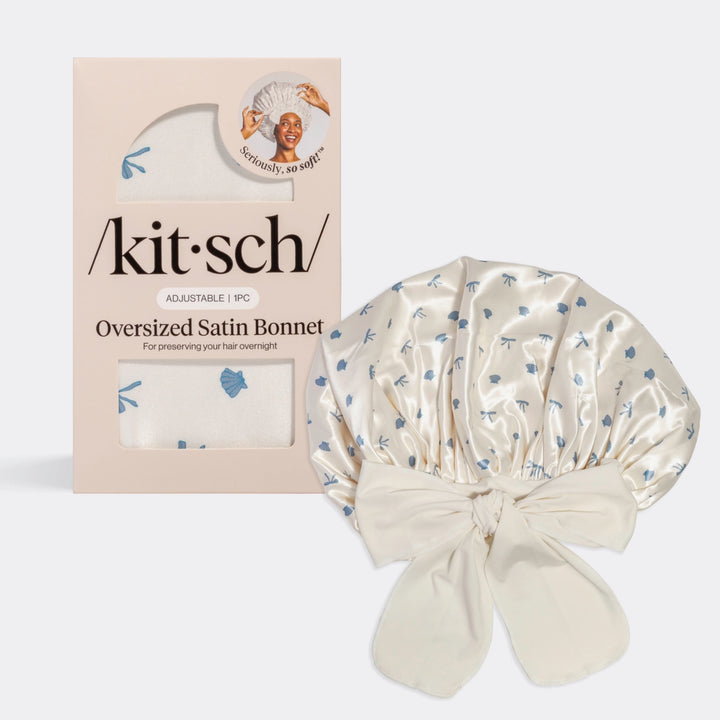 Kitsch oversized satin bonnet with packaging on plain background