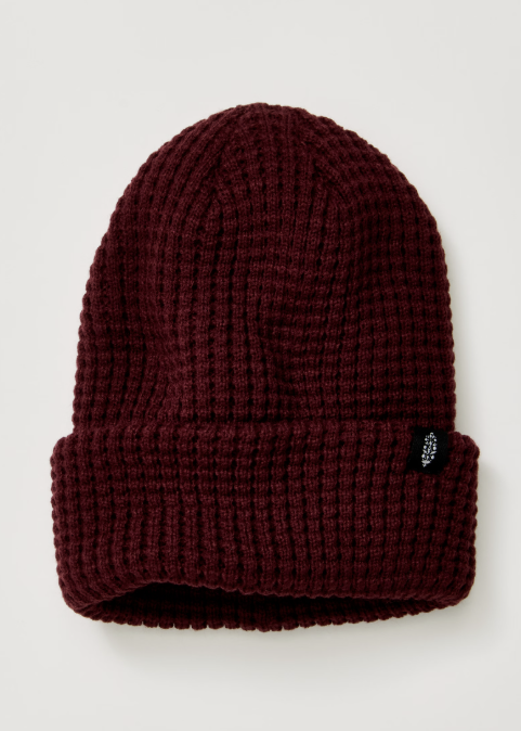 Single maroon beanie with logo on plain background