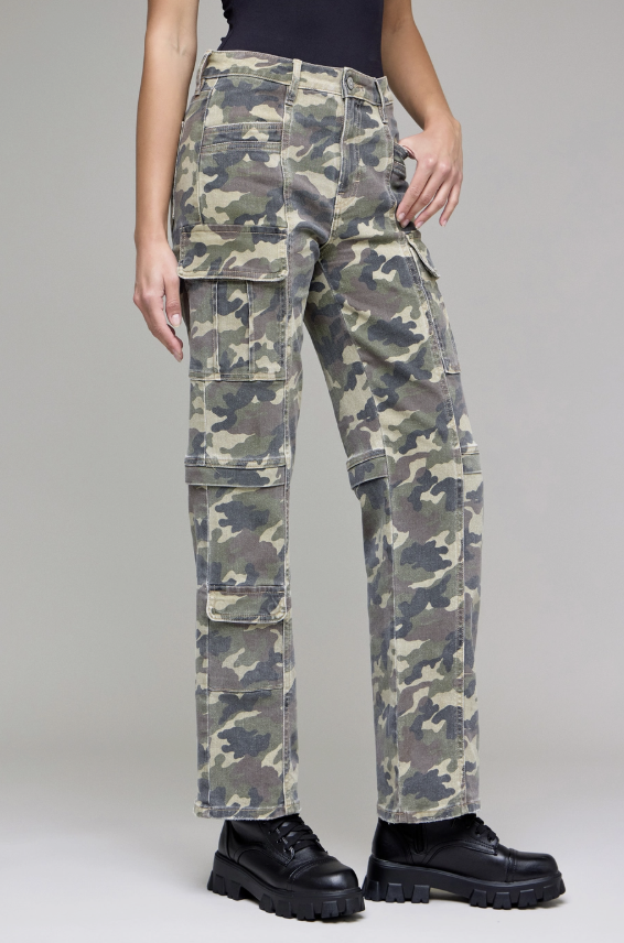 Camouflage cargo pants worn by a person on a plain background
