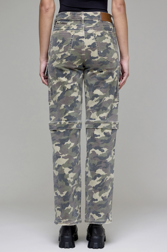 Camouflage pants with a zipper on a plain background