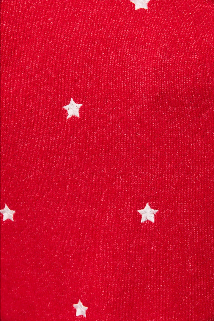 Close up of red cardigan with white stars