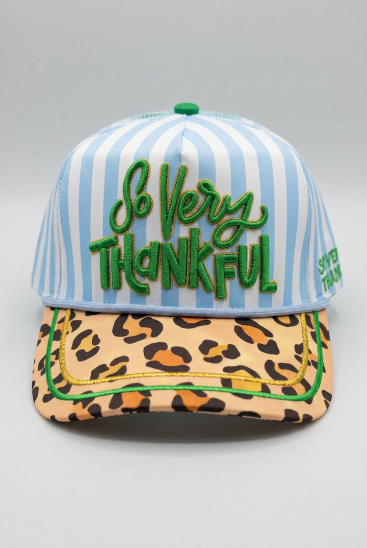 Trucker hat with blue and white stripes and &